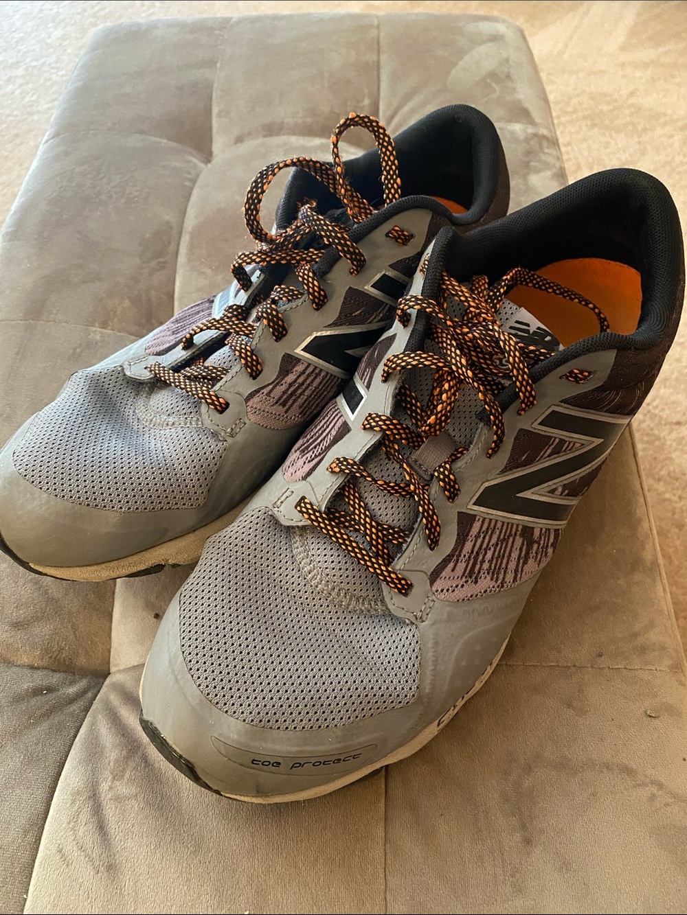 New Balance Men’s Gray Athletic Shoes with Orange Accents